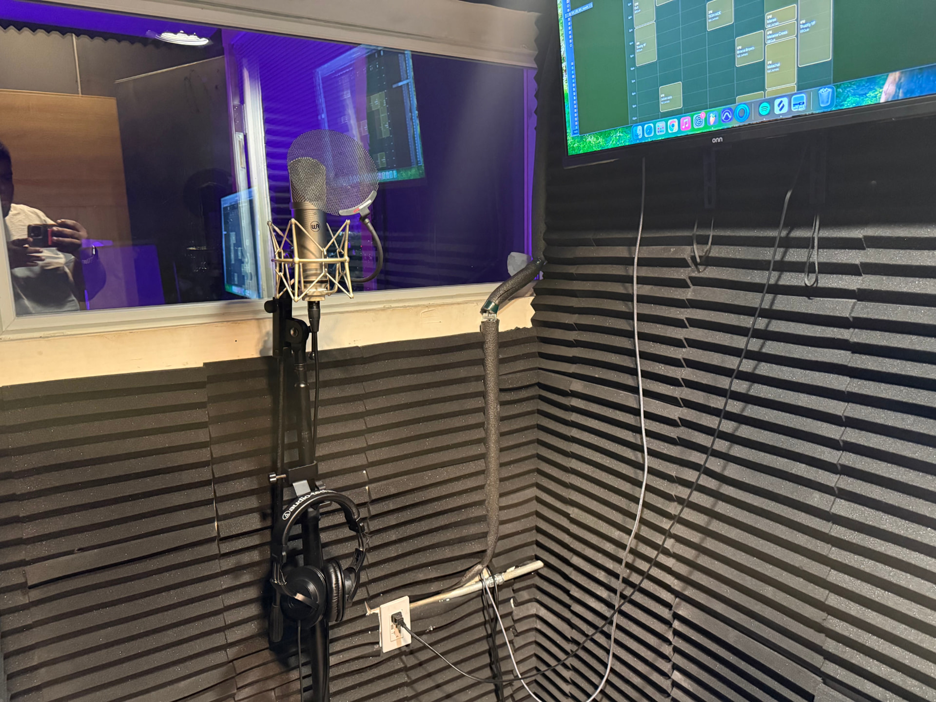 Vocal booth microphone and headphones setup